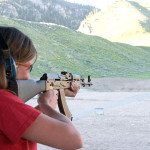 lady trying a traditional sporting rifle AK-47